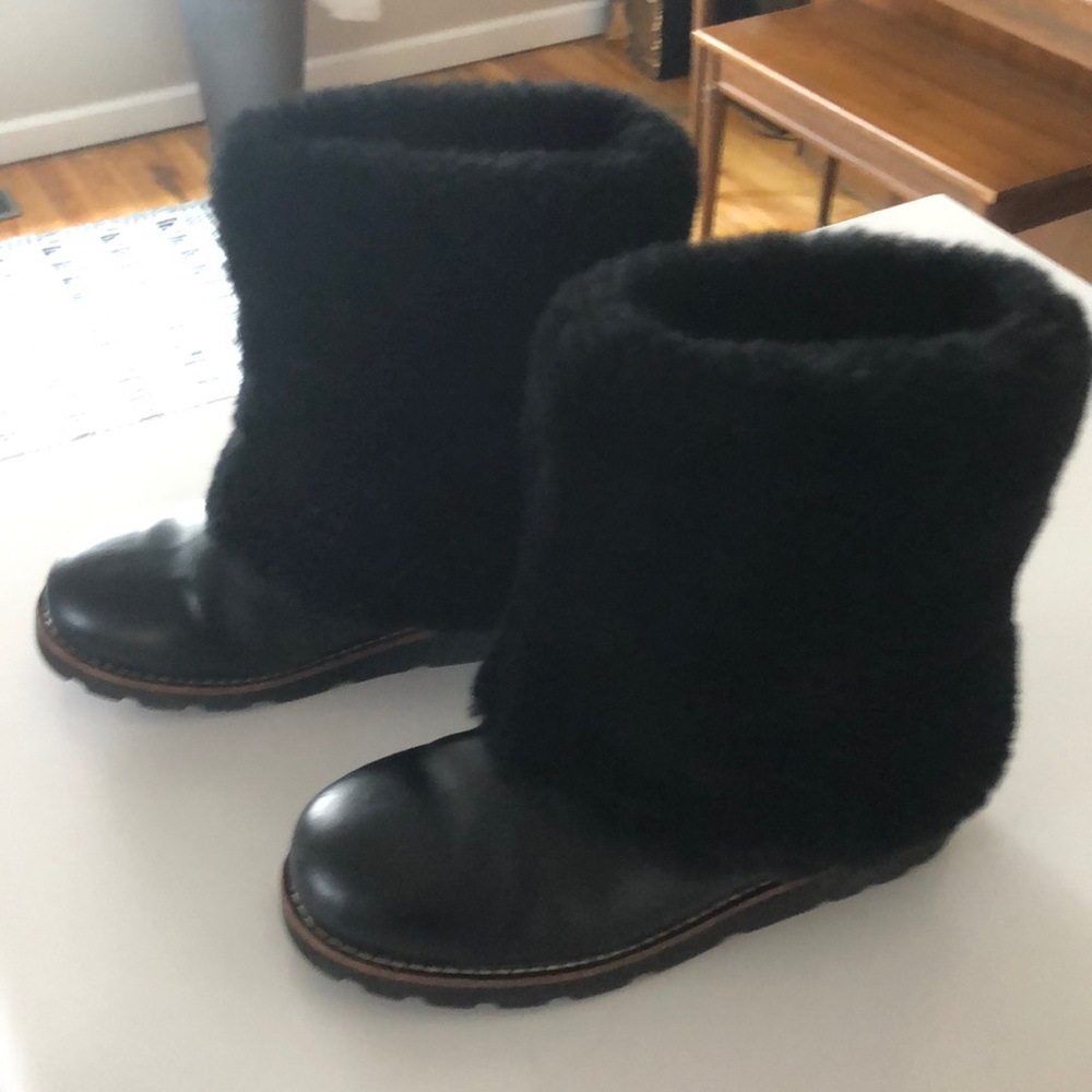 Ugg’s, black pattern leather boots with 7” fur top. Size 6.